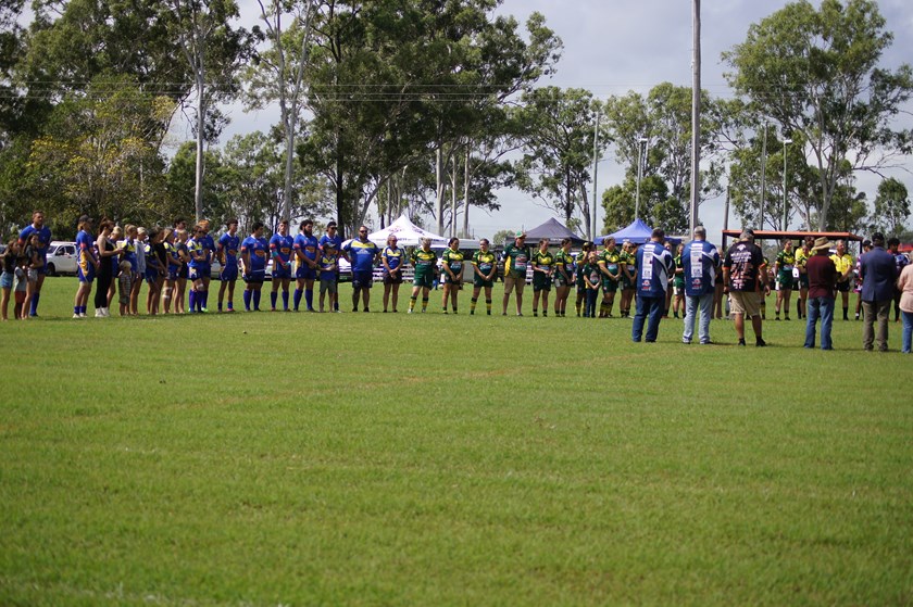Teams paused for the commemorative ceremony during the day. 