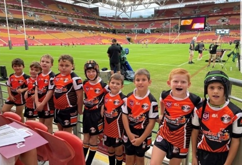 Carina under 8s players at a Brisbane Broncos game.