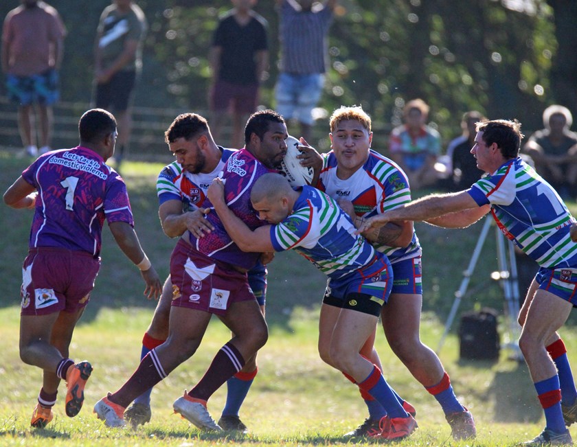 A Yarrabah player is surrounded by Innisfail players during their last clash at Jilara Oval. Photo: Maria Girgenti