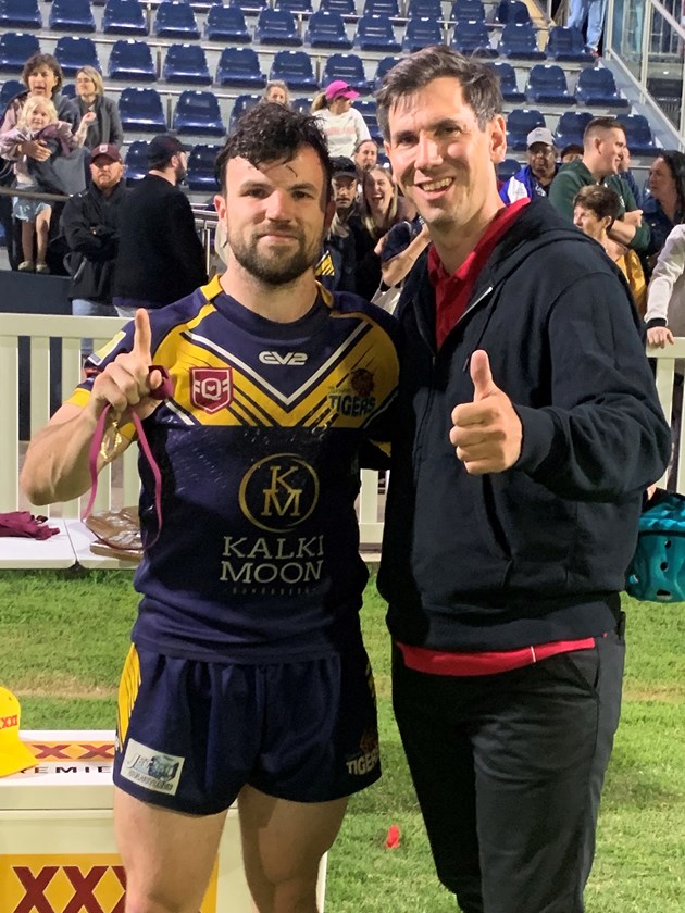 Waves Tigers' James Brosnan receives the Les Somerville Medal for player of grand final from Bundaberg state MP Tom Smith