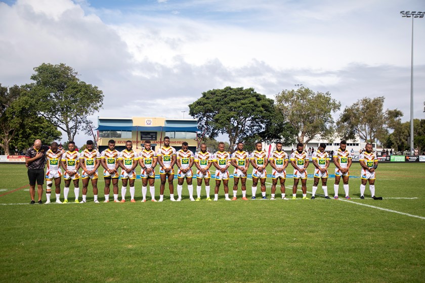 The PNG Hunters and coach Matt Church line up before their first game at their 2021 'home' ground at Runaway Bay in Round 1. Photo: Jim O'Reilly / QRL
