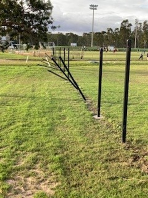 The bent fence posts at the Cowboys.