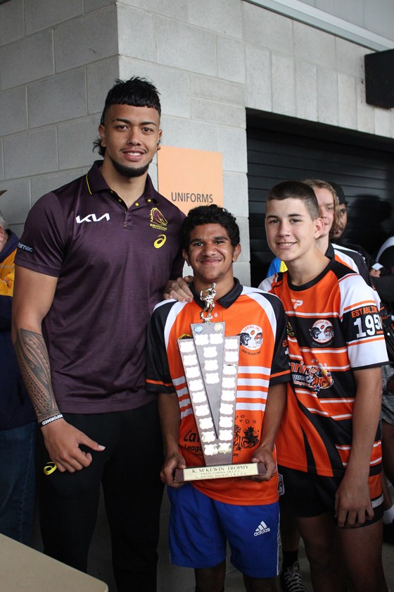 Under 14s Carina players presented with their trophy by Bronco, Xavier Willison.