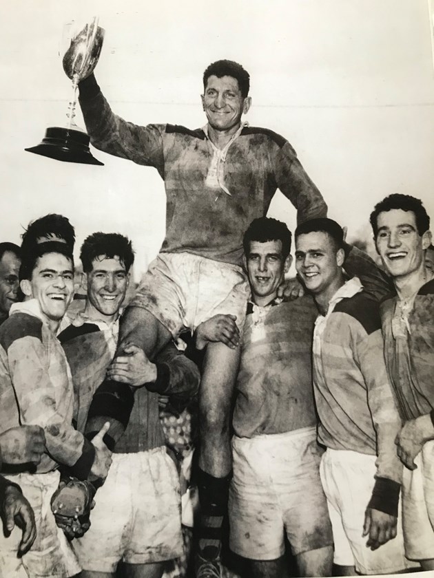 Team mates carry Norths skipper, Bill Pearson after the 18-15 win over Valleys in the 1960 Brisbane grand final.