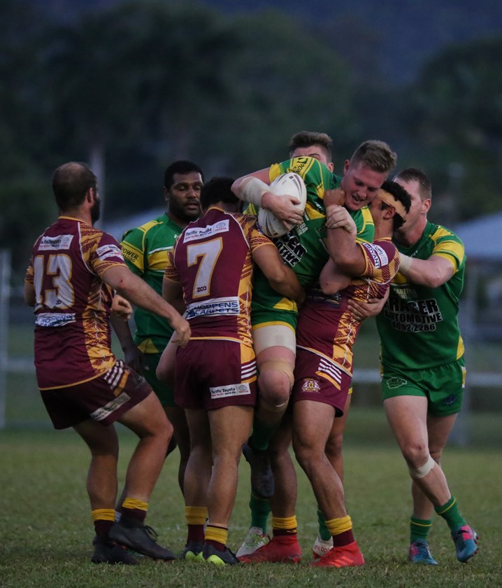 Mareeba's Brodie Walsh is wrapped up tightly by two Southern Suburbs players. Photo: Maria Girgenti