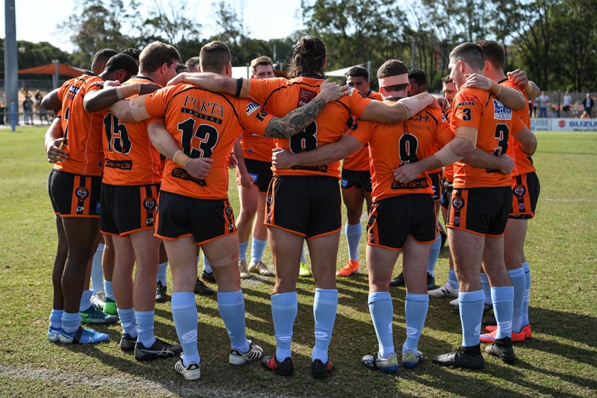 Brisbane Tigers players make a circle while wearing their Turn to Me socks in 2019. Photo: Vanessa Hafner / QRL