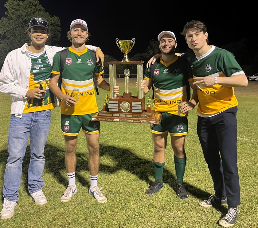 Bo Gibson and Jack Nelson holding the trophy, flanked by Bo's mates Range and Adem.