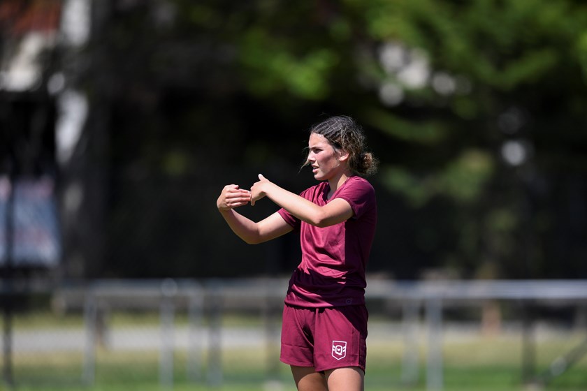 Kaylah talking with teammates at Queensland Under 17 City girls training. Photo: Zain Mohammed/QRL