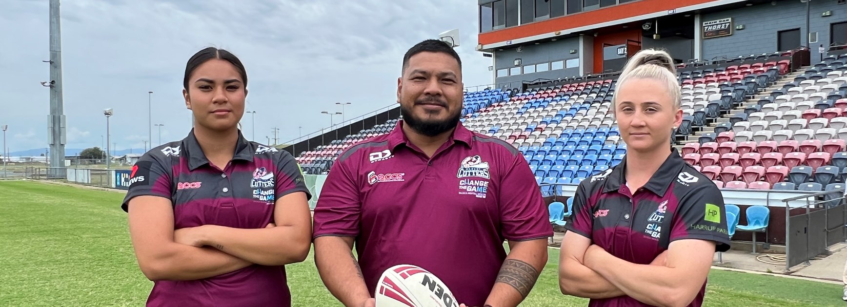 Players Jasmine Peters and Emma Manzelmann with coach, Marco Peters. Photo: Mackay Cutters/QRL