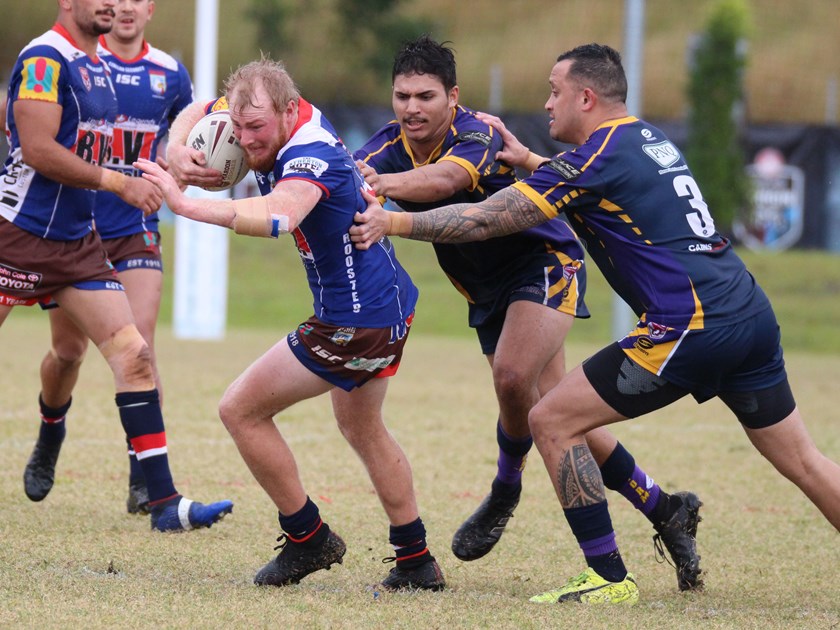 One of Atherton's try scorers Matt Baillie draws in two Edmonton Storm defenders Photo: Maria Girgenti