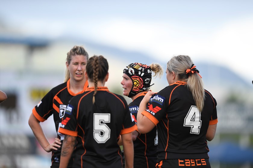 Katherine Moore speaks to her Tigers team mates. Photo: Ian Hitchcock / QRl