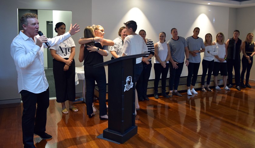 Members of the 20-Year Anniversary Souths Logan Women's team are presented by Rob Brough. Photo: QRL Media