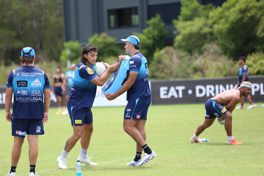 Working with Tino Fa'asuamaleaui at Titans training. Photo: Colleen Edwards/QRL