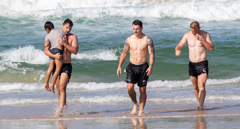 Lachlan Maranta, Sebastian Winters-Chang and Tommy Farr come to the aid of a swimmer in distress. Photo: Jim O'Reilly