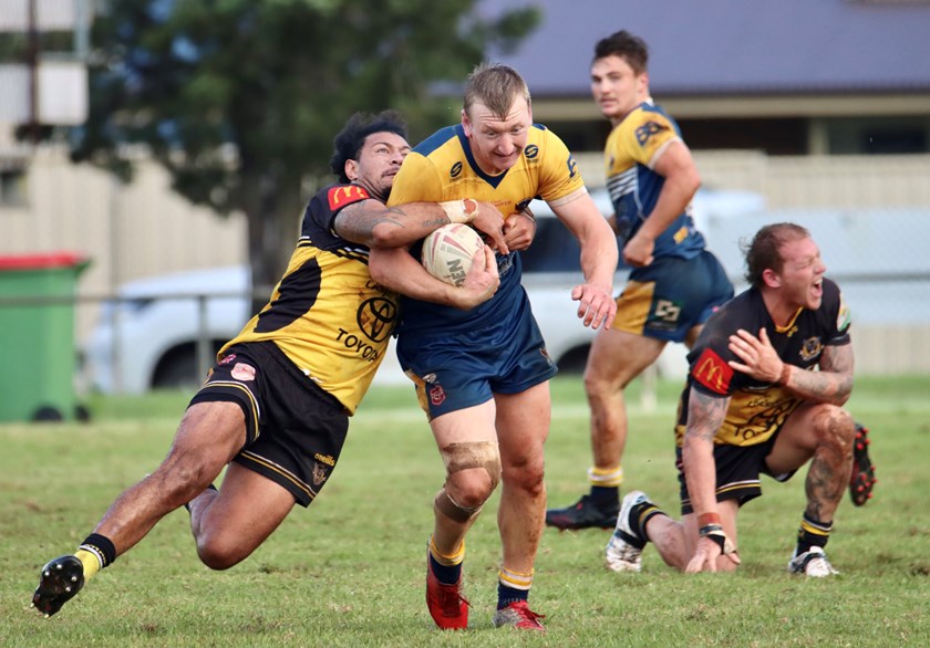 Gatton's Tupi Lisate takes on Highfields' Carl Clement at Brothers' Glenholme Park. Photo: Toowoomba Rugby League