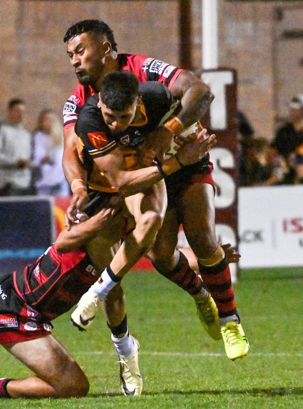 Gatton's Cameron Bundock is smothered by Valleys' Komiti Vetemotu