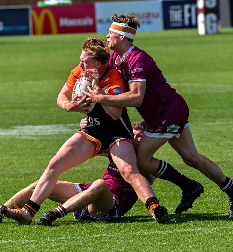 Souths Under 19 captain Tait Cameron is tackled by Dalby's Matthew Drews