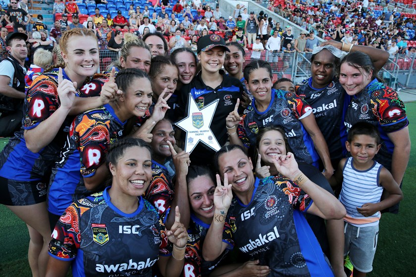 The Indigenous All Stars celebrate their 2017 win.
