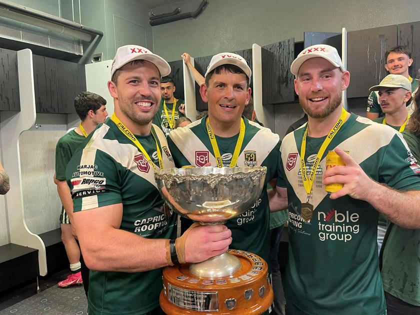 Maroochydore Swans players celebrate their victory.