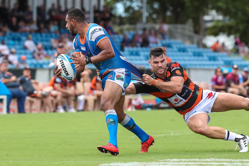 Formerly with the Pride and now with Easts; Brayden Torpy attempts to bring down Gideon Gela-Mosby in their Round 6, 2018 Intrust Super Cup match at Barlow Park. 
