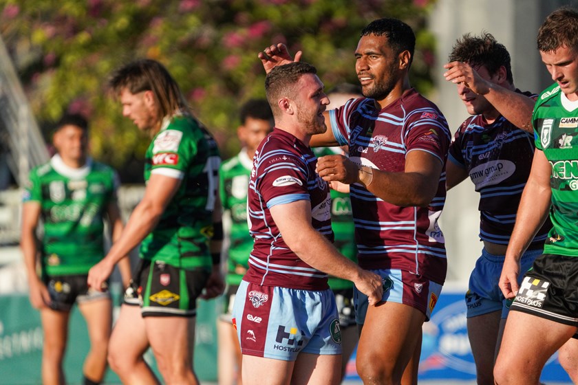 Trey Brown celebrates a try with JJ Collins in Round 20. Photo: Luke Fletcher/QRL