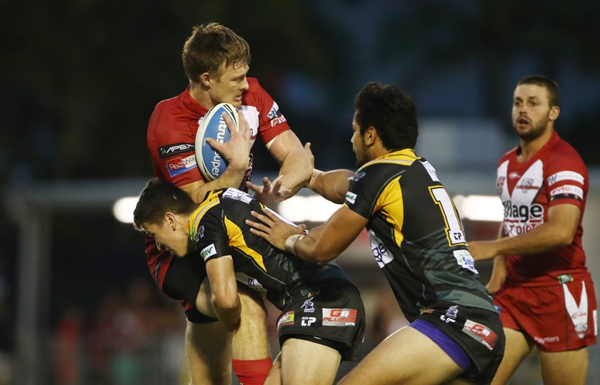 Dolphins' Aaron Whitchurch, who played with Ackerman, is tackled. Photo: QRL Media