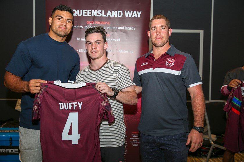 Brayden Duffy is presented with his jersey by David Fifita and Keiron Lander. Photo: QRL Media