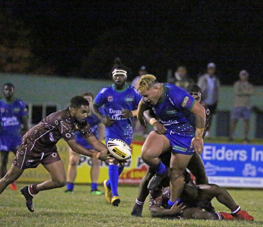 A Yarrabah player picks up the scraps after Usaia Fonongaloa spills the ball in a tackle. Photo: Maria Girgenti 