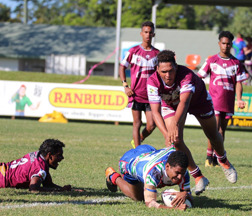 Rhaymus Tomarra crashes over for Innisfail's first try in the Under 18s game. Photo: Maria Girgenti