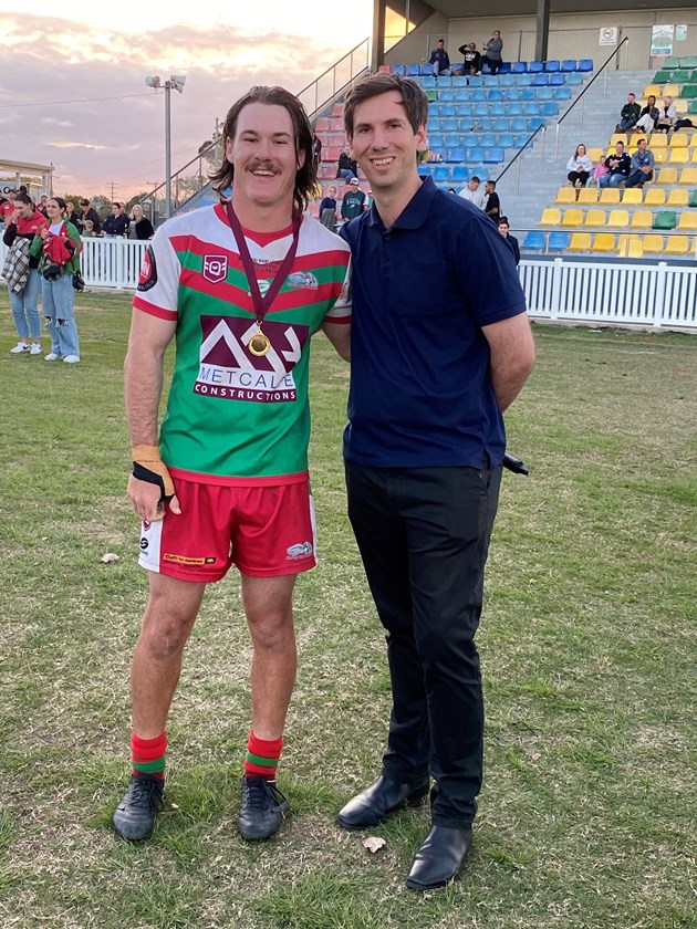Hervey Bay Seagulls’ Max Shorter receives the Les Somerville Medal for grand final best and fairest from State Member for Bundaberg Tom Smith. Photo: Vince Habermann