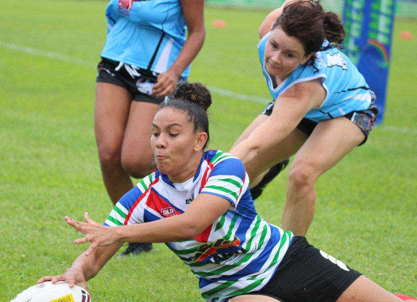 Tilly Fejo scores for Innisfail right on half time in the women's touch football game between Mossman-Port Douglas Sharkettes.