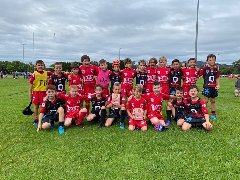 Under 8s: Currumbin Red and Mudgeeraba Black after exchanging awards.