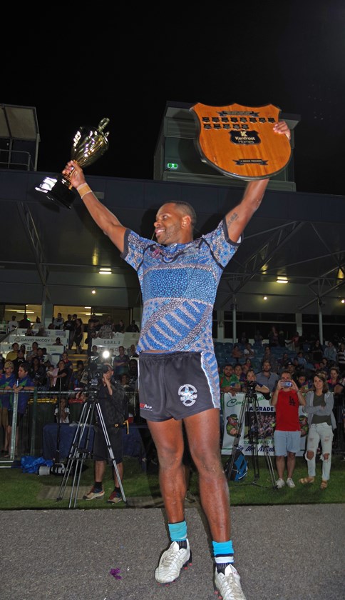 Mossman-Port Douglas A grade co-captain Joel Marama proudly lifted the shield and trophy after his side defeated Innisfail and secured consecutive premierships. Photo: Maria Girgenti