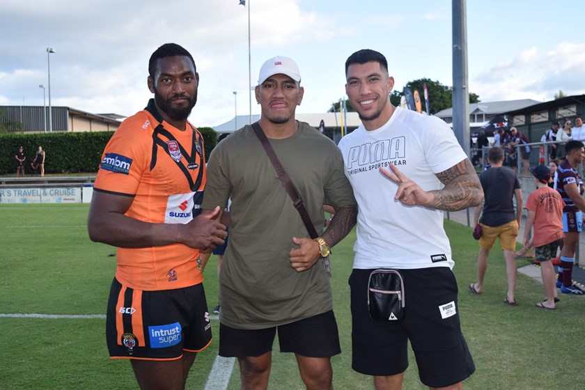 Two former Capras BJ Aufaga To’omaga (centre) and Aaron Pene (right) with Tigers back Isaac Lumelume after the Round 1 Tigers v Capras match. Photo: Mel Tabet / QRL