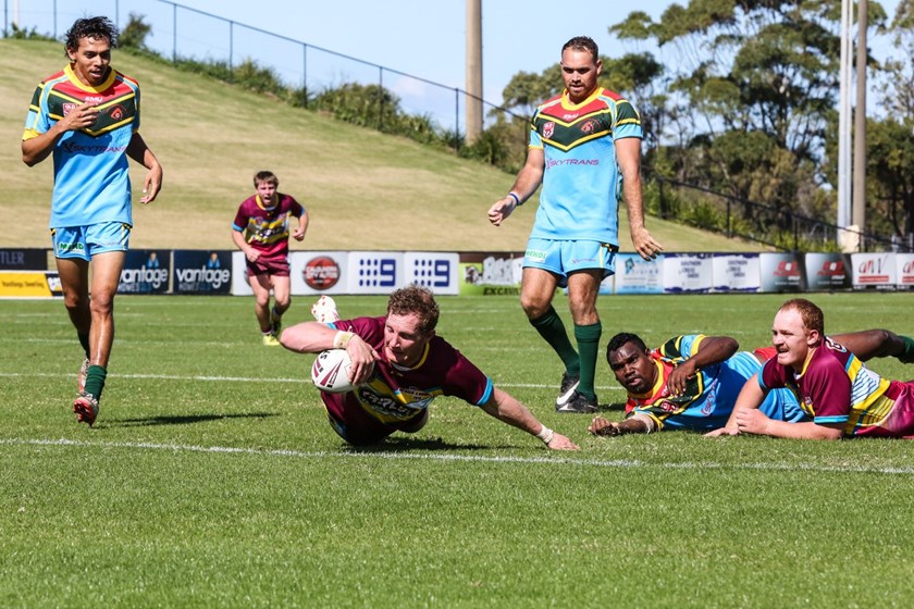 Outback's Michael Fletcher stretches over for a try. PHOTO: Ritchie Duce - Level Eleven Photography