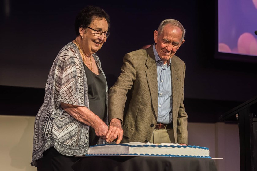 Tom Barrett and Bev Wright cut the 100th anniversary cake. Photo: Chris Robson