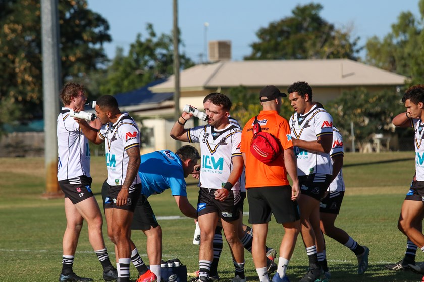 Rory Ferguson and the Souths Logan Magpies take a drinks break during their Round 14 Activate! Queensland Country Week game in Richmond. Photo: Colleen Edwards / QRL