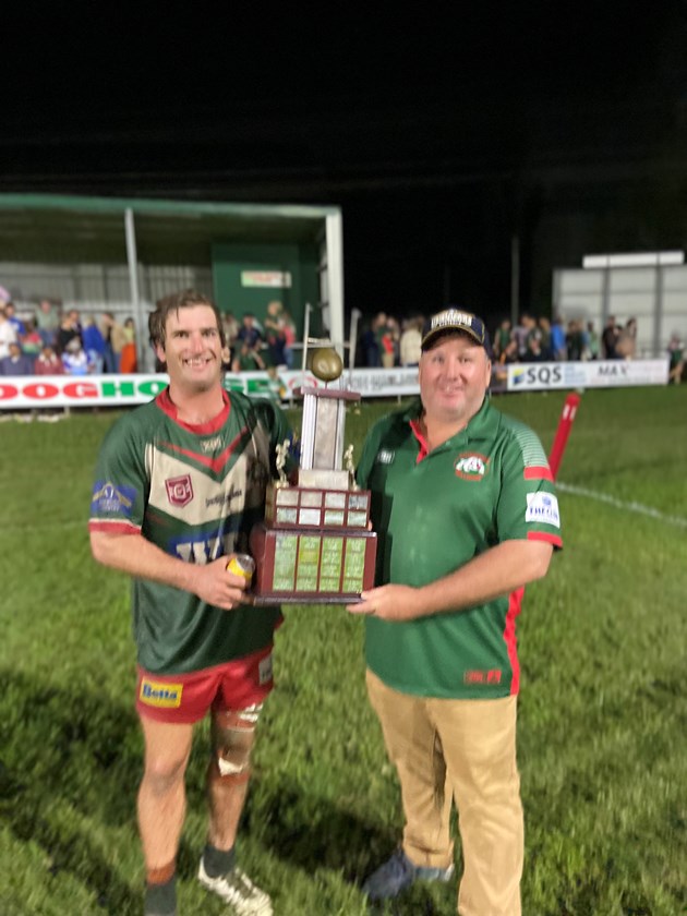 Matt Eising and Reon Rodwell with the Terry Charles Memorial Cup preseason trophy.