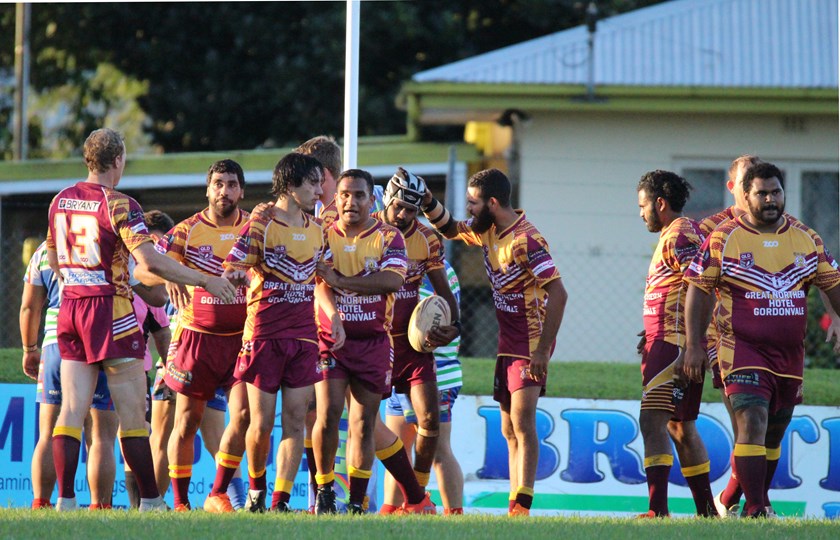 Southern Suburbs Reserve grade players congratulate each other after a try is scored in the game against Innisfail. Photo: Maria Girgenti