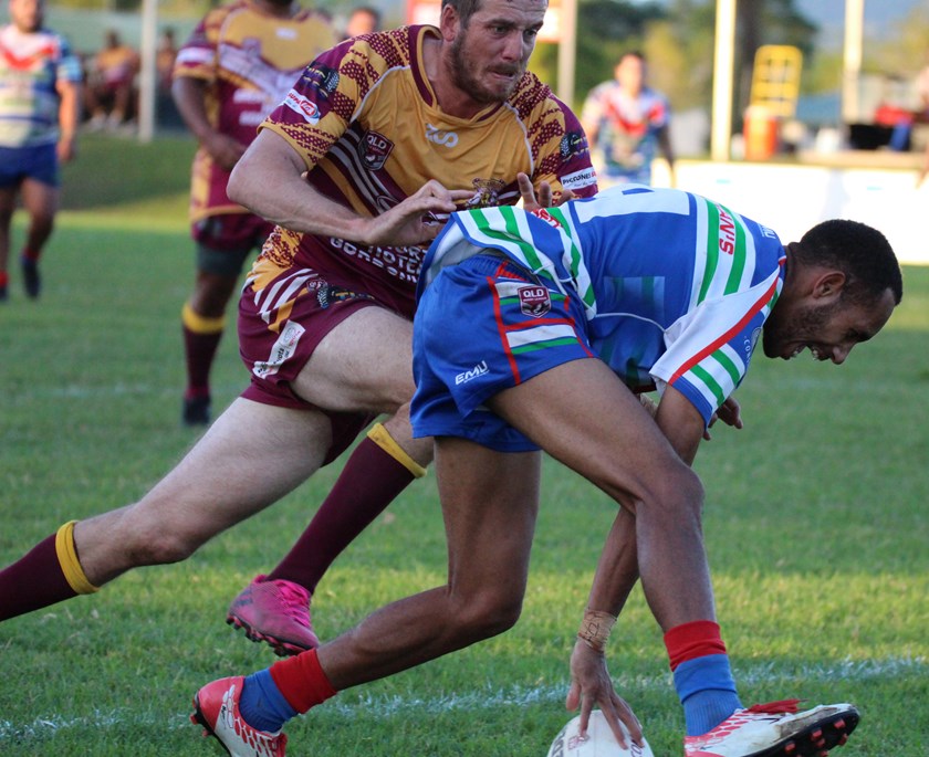 Innisfail's Jackson Laza beats the Southern Suburbs defence to plant the ball down for the home side's third try in the Reserve grade game. Photo: Maria Girgenti