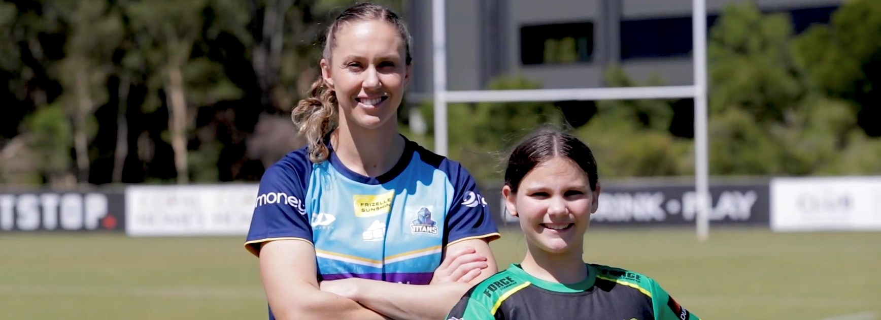 Karina Brown with Helensvale Hornet player, Jenna. Photo: Gold Coast Titans