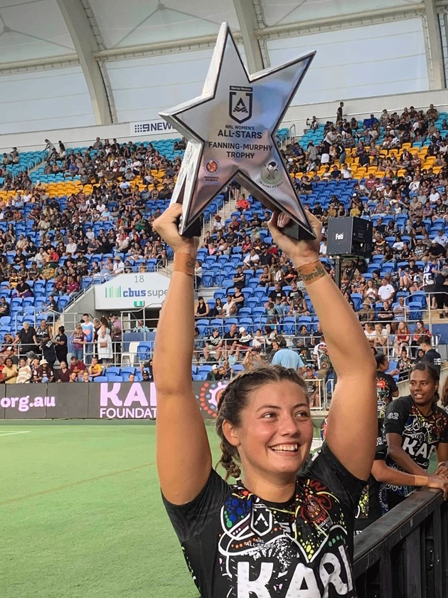 Holding the trophy aloft after winning the NRL All Stars match with the women's Indigenous team in 2020. Photo: submitted by Kelsey Parkin