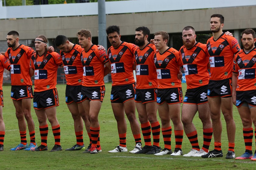 Tigers players lined up before playing PNG Hunters. Photo: QRL Media
