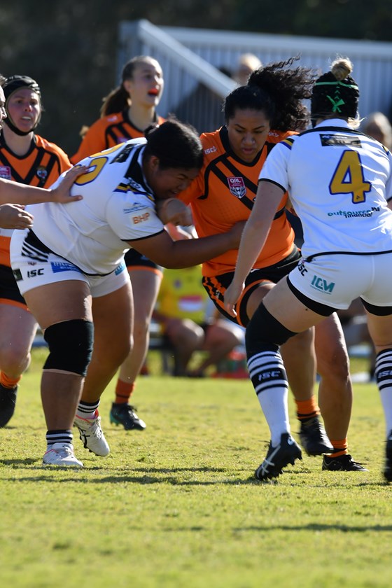 Ayla Cook of Easts Tigers gets tackled. Photo: Margaret Keates / Easts Tigers