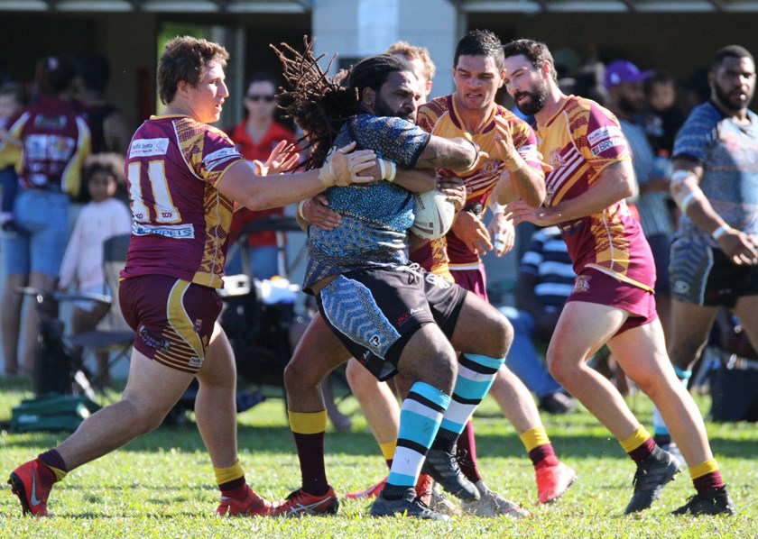 Mossman-Port Douglas Sharks player Matthew Bonn proves difficult for the Southern Suburbs defence to bring down Photo: Maria Girgenti