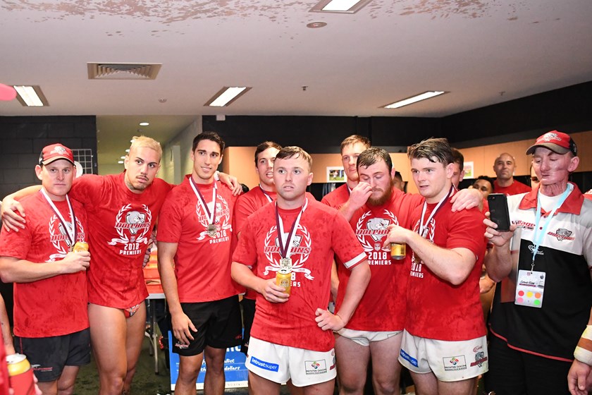 Jon Sloan (far right with phone) in the victorious Redcliffe Dolphins dressing sheds following the club's 2018 Intrust Super Cup title win.