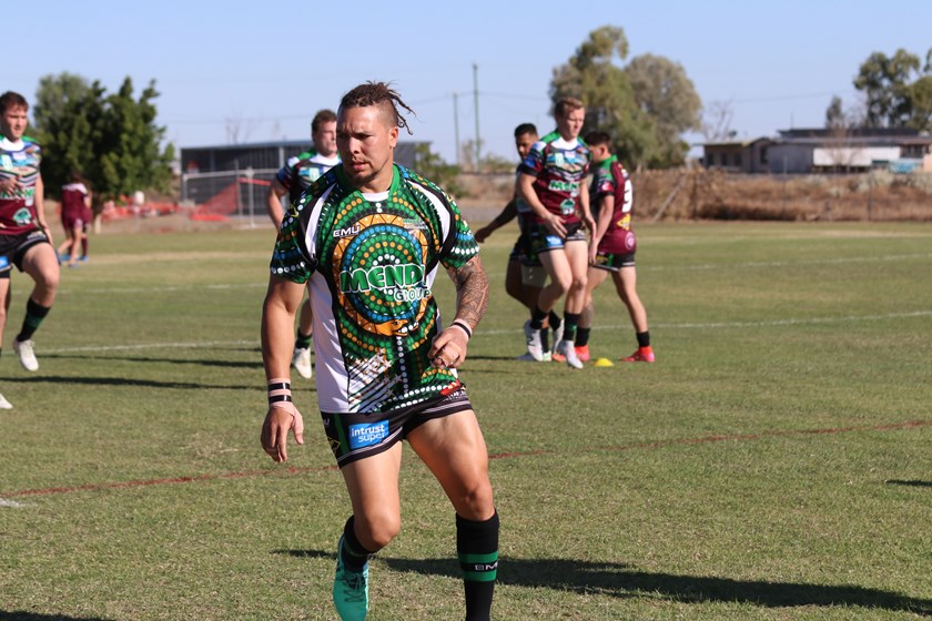 Shaun Nona warms up for the game Activate! Queensland Country Week game in Richmond. Photo: Colleen Edwards / QRL