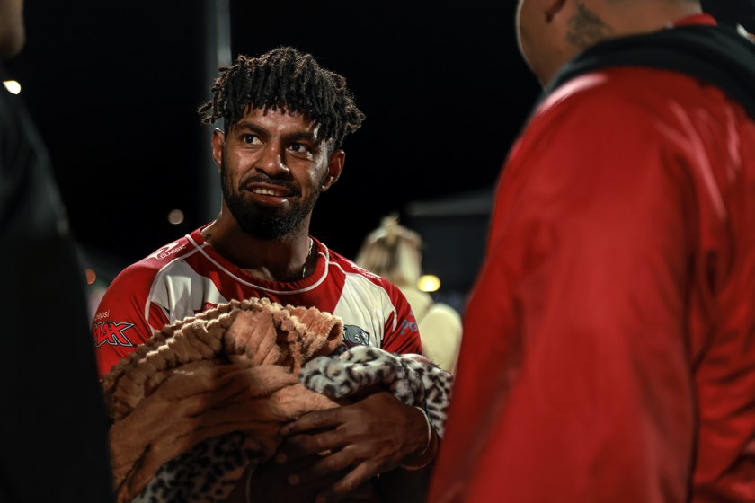 Numambo with his young daughter after the game against PNG. Photo: Mitch Townsend/QRL