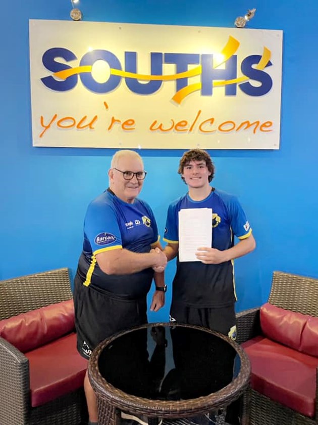Bailey Anderson celebrating his three-year Melbourne Storm contract with Souths Junior Sharks Mackay under 16s coach, Ray Seymour. Photo: Souths Junior Sharks Mackay Facebook