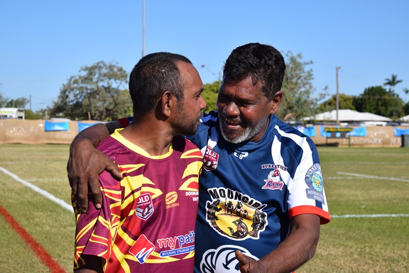 Doomadgee and Burketown players catch up during the Battle of the Gulf finals. Photo: QRL Media